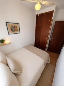 a bedroom with two beds and a closet at Mabre view in La Mata