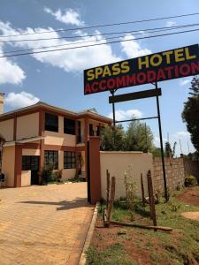ein Schild für eine Spiss-Hotelunterkunft in der Unterkunft Spass Hotel in Eldoret + 9 Fotos