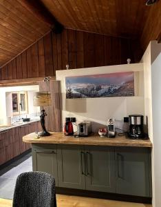a kitchen with a counter with two coffees on it at Squaw Peak in Morzine