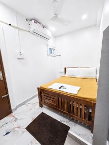a room with a bed in a room at LS Residency Ac in Thiruchendur