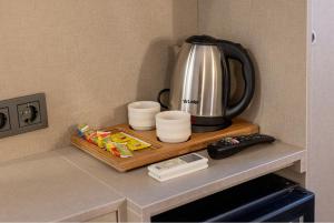 a coffee maker on a shelf in a kitchen at Nova Prime in Bodrum City