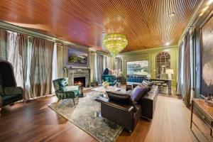 a living room filled with furniture and a chandelier at Stylish Dallas Condo Resort-Style Pool in Dallas