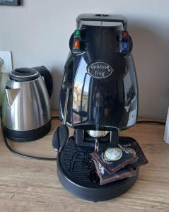 a coffee maker sitting on top of a table at Ognina Sea in Catania