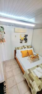 a bedroom with a large bed and a table at Casa fig Crete in Chania