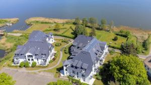 an aerial view of a large house on a island at Residenz Kümpel in Balm +18 photos