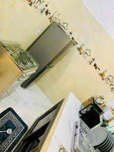 a kitchen with a sink and a counter top at Kër-Mame Tawfekh in Thiès +14 photos