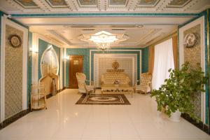 a room with a bed and chairs and a ceiling at Dendi hotel bukhara in Bukhara +37 photos
