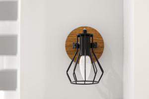a black light fixture hanging on a white wall at Bright 2BR Flat Close to Shops in Beckenham in Beckenham