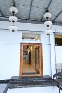 a hallway with a mirror on the side of a building at Hotel Siya Grand in Tirupati