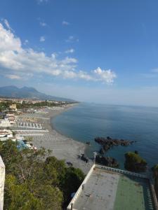 a view of a beach and the ocean at Villa Julieta in Scalea