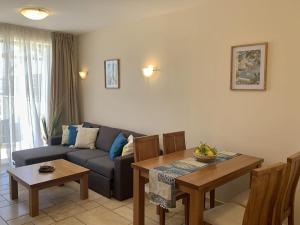 a living room with a couch and a table at Kaliakria Pearl Resort in Topola