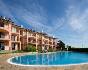 a large apartment building with a large swimming pool at Kaliakria Pearl Resort in Topola