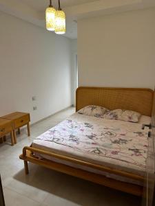 a bed in a white room with a bed sidx sidx sidx at Zaineb in Hammamet Sud