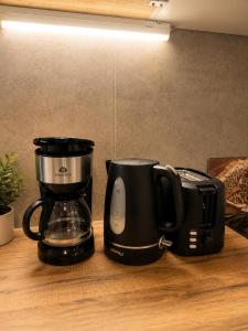two coffeemakers sitting on top of a counter at l'Ecrin Bellevue in Aix-les-Bains