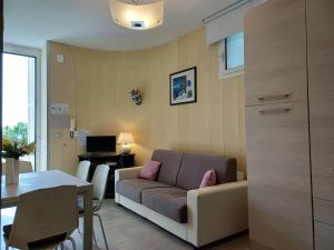 a living room with a couch and a table at Total Relax Home by Holiday World in Framura