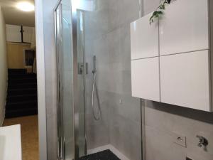 a shower with a glass door in a bathroom at Total Relax Home by Holiday World in Framura +22 photos