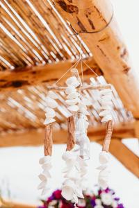a chandelier with white shells hanging from a ceiling at Tenuta Mari in Castelnuovo Cilento
