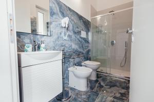 a bathroom with a toilet and a sink and a shower at Tenuta Mari in Castelnuovo Cilento +31 photos