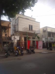 a group of motorcycles parked in front of a building at Raya Raj Anugraha in Kumbakonam