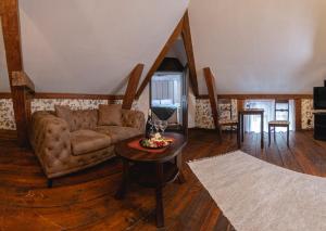 a living room with a couch and a table at Alatskivi Castle in Alatskivi