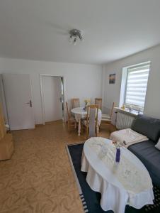 a living room with a couch and a table at Holm in Melsungen