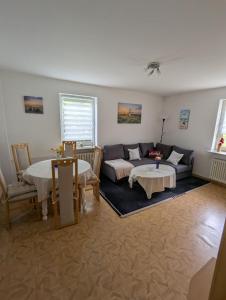 a living room with a couch and a table at Holm in Melsungen