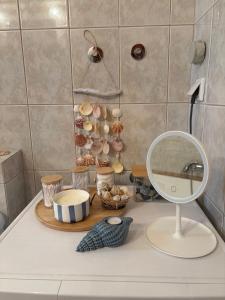 a bathroom counter with a mirror and a sink at Luxury View in Iraklitsa +19 photos