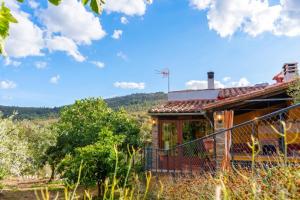 a house with a view of a mountain at Cozy studio in Valencia de Alcántara 25 m² lovely garden in Valencia de Alcántara
