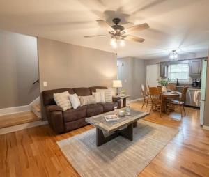 a living room with a couch and a table at Mountain Hideaway at Cabins in the Clouds in Rising Fawn