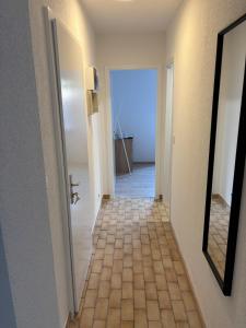 a hallway with a door leading to a room at City Saint-Louis in Saint-Louis