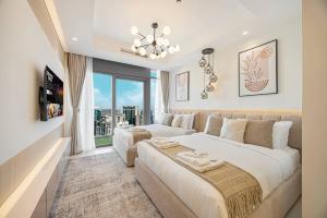 a bedroom with two beds and a large window at Downtown Dubai's Highest Infinity Pool, Paramount Hotel Midtown in Dubai +276 photos