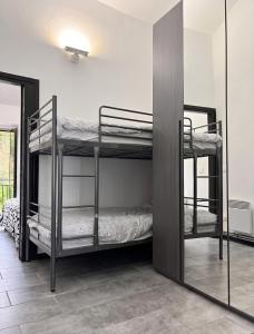 two bunk beds in a room with a mirror at House with Private Pool in Spindoli - 100 m² in Spindoli