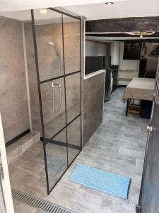a shower in a room with a blue mat at House with Private Pool in Spindoli - 100 m² in Spindoli