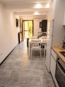 a kitchen with a table and a dining room at House with Private Pool in Spindoli - 100 m² in Spindoli +22 photos