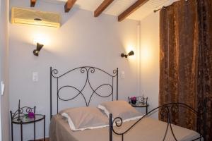 a bedroom with a bed and two side tables at Villa cosy avec piscine privée - Le Gosier. in Le Gosier +13 photos