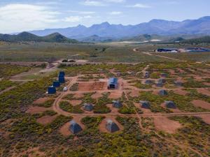 an aerial view of a farm with mountains in the background at Karoo 62 Escape - A-frame in Ladismith +3 photos