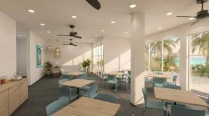 a restaurant with wooden tables and chairs and windows at Nala Inn in Fulidhoo