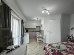 a small bedroom with a bed and a kitchen at Countryside Studio Apartment Valentina in Vrh