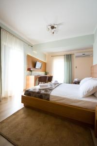 Cama o camas de una habitación en Olympion