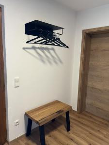 a room with a wooden table and a bench at Ferienwohnung Lisa in Grabenstätt