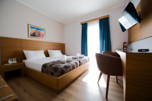 Cama o camas de una habitación en Olympion