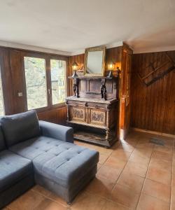 a living room with a couch and a mirror at Spacious House in Canejan with Mountain View in Caneján +45 photos