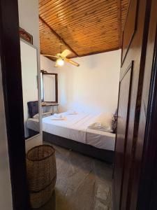 a bedroom with a bed and a mirror in it at Fisherman's Cove Epanomi in Epanomi