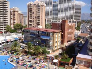 an aerial view of a city with a pool and buildings at Primavera - Zand Properties in Benidorm