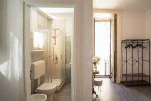 a bathroom with a toilet and a walk in shower at B&B Università in Catania