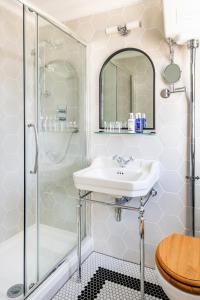 a bathroom with a shower and a sink at The Berkeley Square Hotel Bristol in Bristol +96 photos
