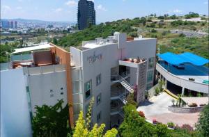 an aerial view of a hotel with a pool at Apartment with Pool & Gym in Querétaro