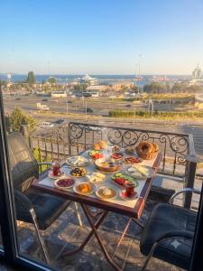 a tray of food on a table on a balcony at Kumkapı Hotel - Special Category in Istanbul