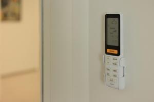 a remote control is attached to a refrigerator at VItruVIo POP in Fano