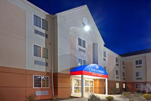 a building with a cambria hotel sign in front of it at Candlewood Williamsport by IHG in Williamsport